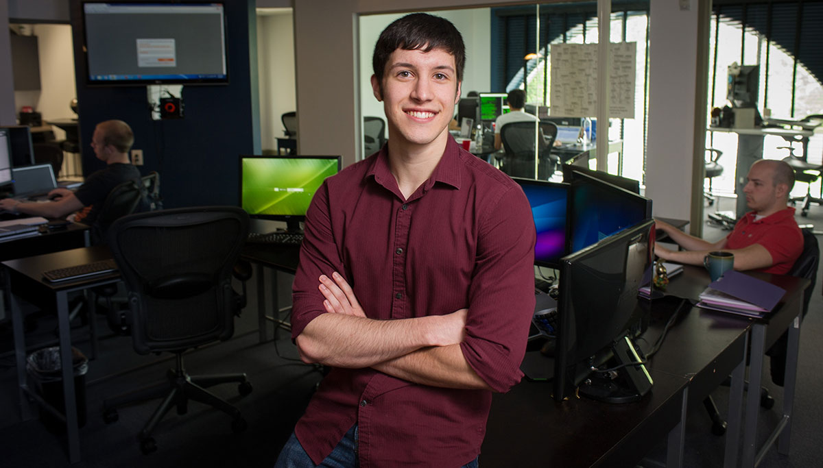 Stephen Dolan poses in his workplace at Nead Werx