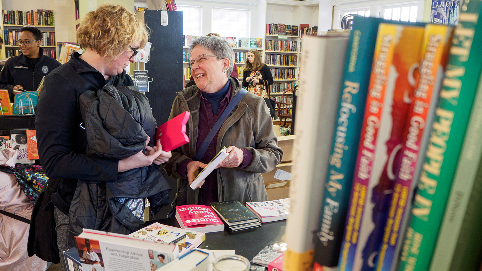 people talking at charis books