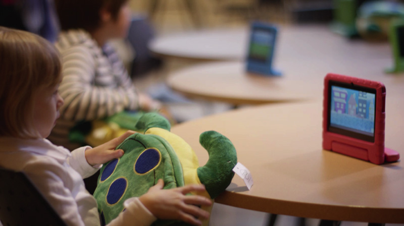 A child using a Zyrobotics accesible learning toy