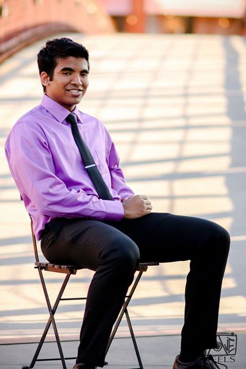 Portrait of Varun Yarabarla sitting in a chair outside