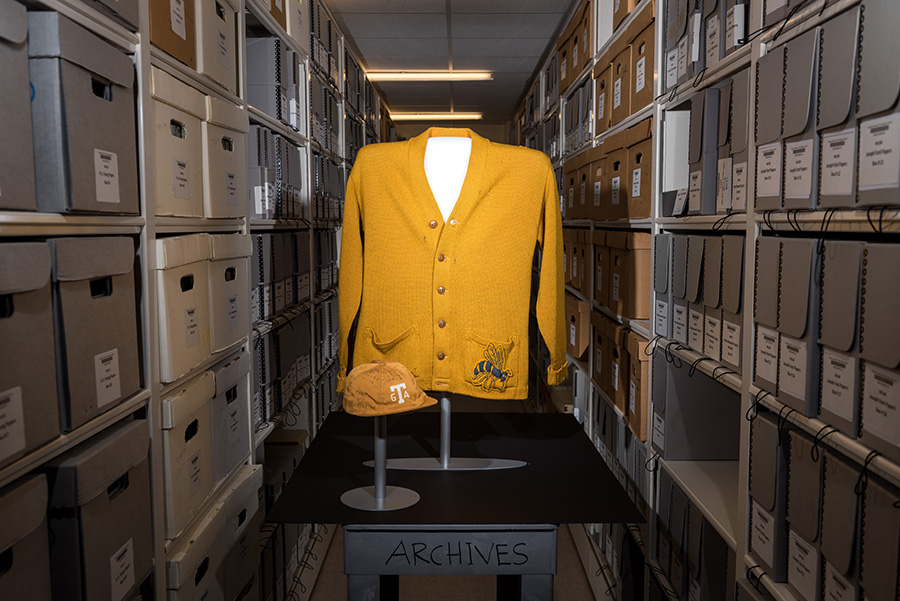 This gold cardigan and RAT cap combination belonged to Elizabeth Herndon, one of the first two women to attend Tech in 1952.