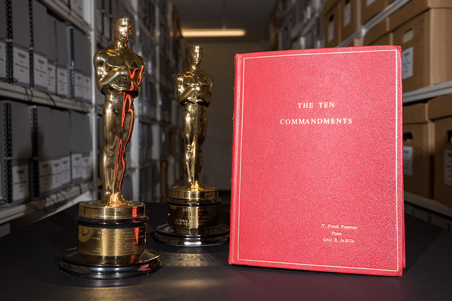 These two Oscars belonged to Y. (Young) Frank Freeman, EE 1910, and executive vice president of Paramount Pictures, which produced The Ten Commandments. One is for humanitarian work and the other is for lifetime achievement.