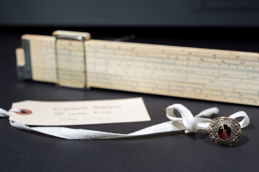 Elizabeth Herndon’s class ring – made in a men’s size because class rings weren’t manufactured in women’s sizes at the time – is pictured with her slide rule.