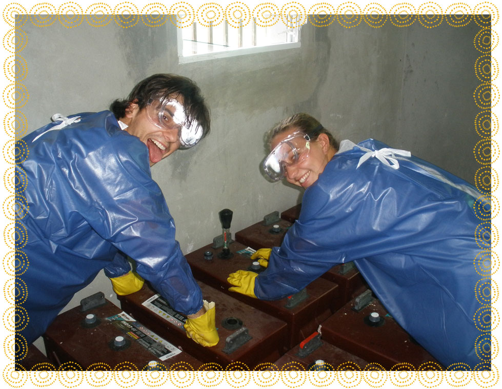 Students installing batteries to store solar energy