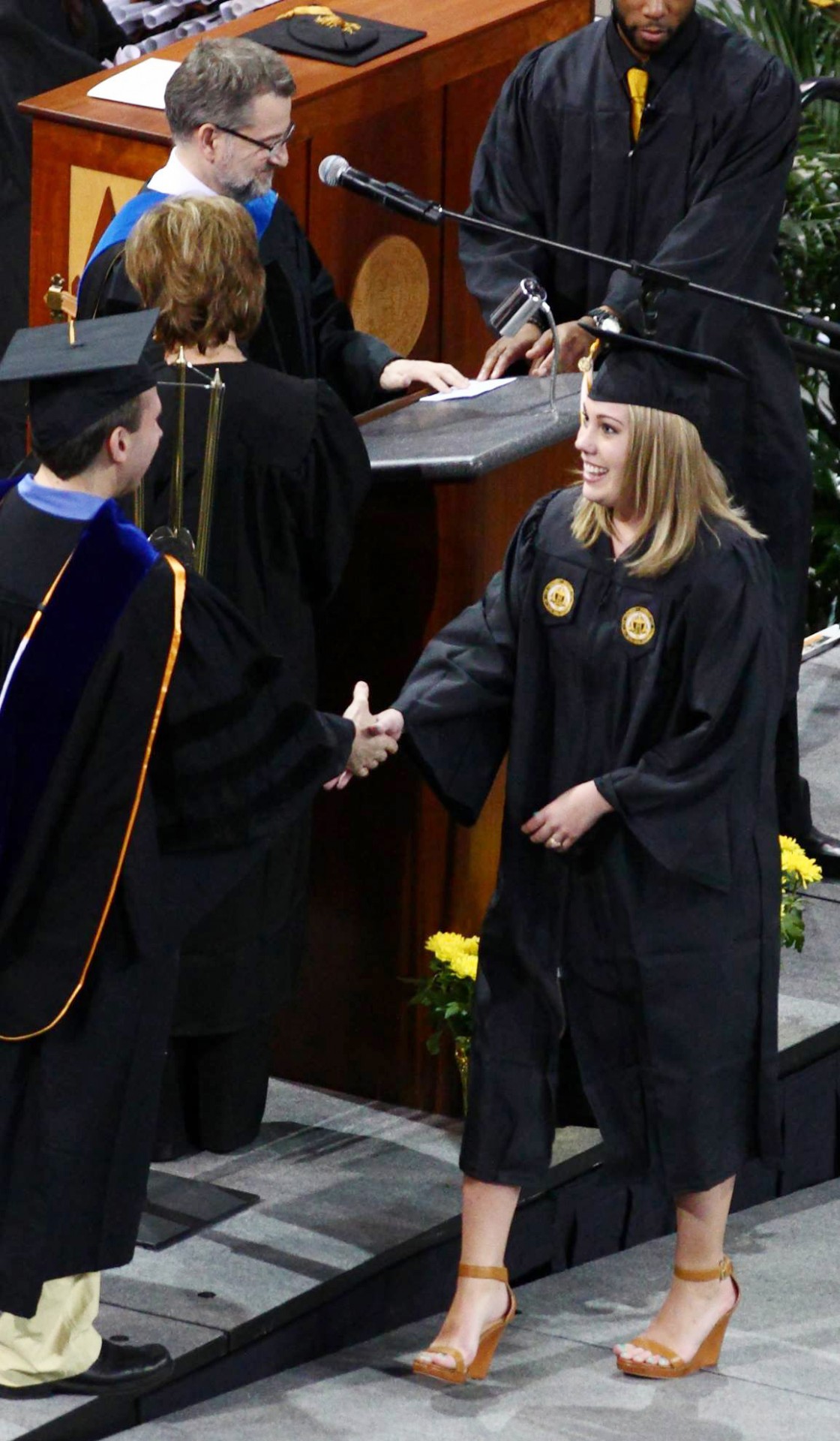 Michael Smith calling names at Commencement