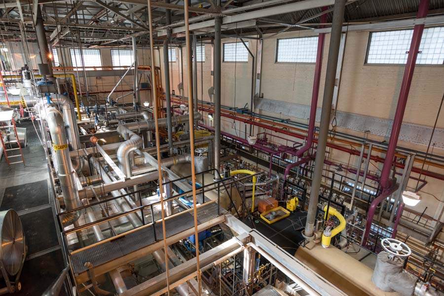 The boiler room has four boilers, including one that is all electric. A ceiling vent allows heat to escape in the summer, when the room’s temperature often reaches 100 degrees.