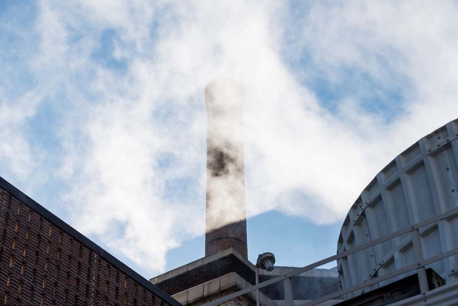 The smoke stack of the Holland Plant is the exhaust for the natural gas boilers. The mist shown is the drift from the cooling tower.
