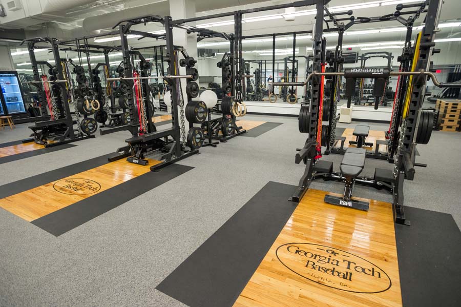 The floor design of the baseball weight room gives a nod to the Louisville Slugger.