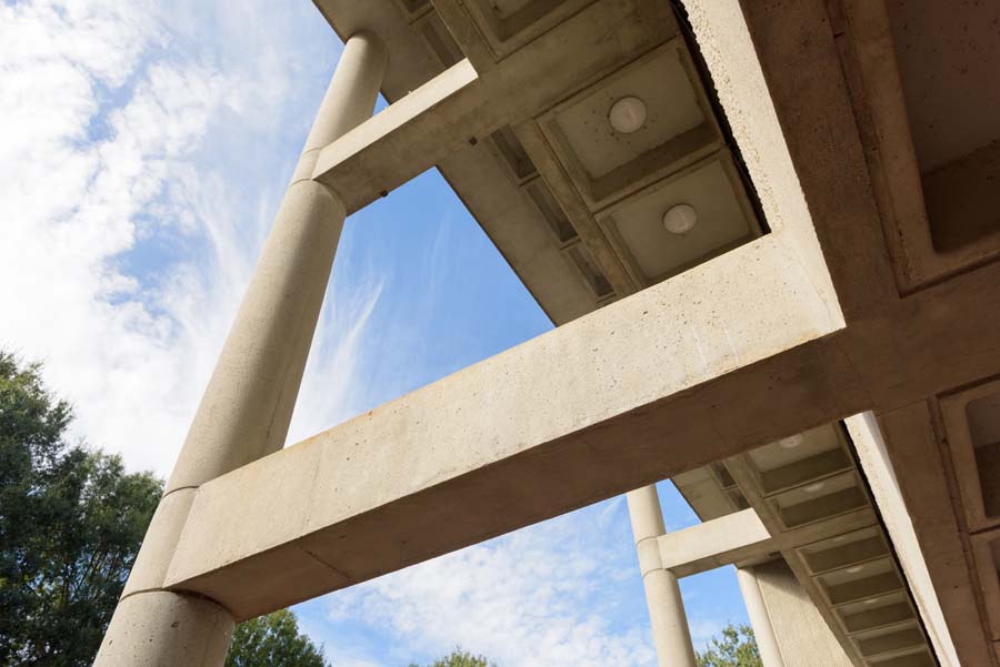 The open structural framework of the West Architecture Building creates a porch-like sheltered extension of lobby space.