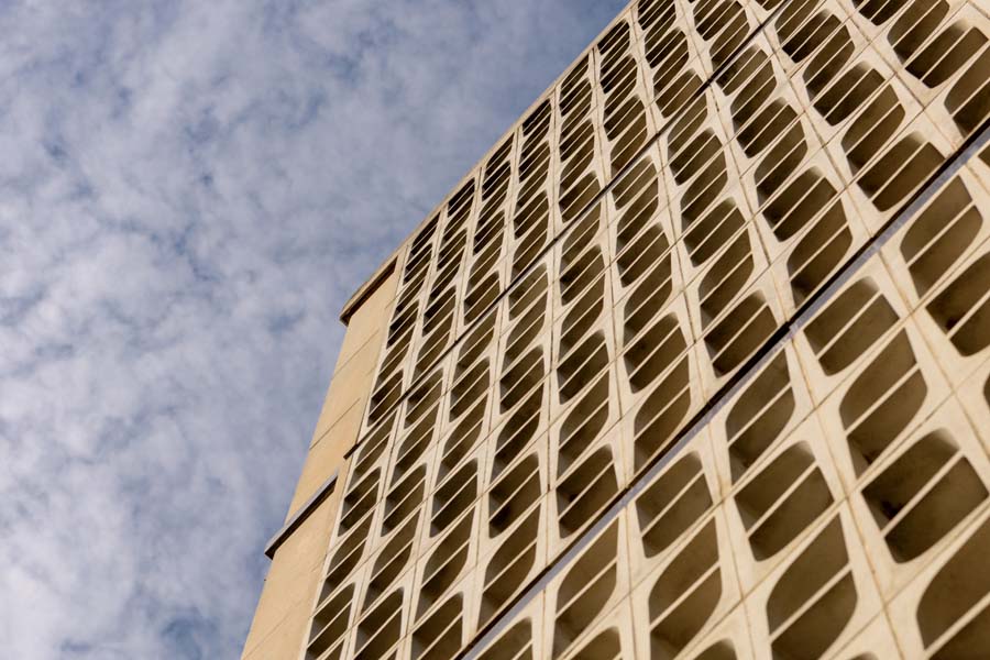 Walls of patterned concrete blocks let in both light and air for the Van Leer Building.