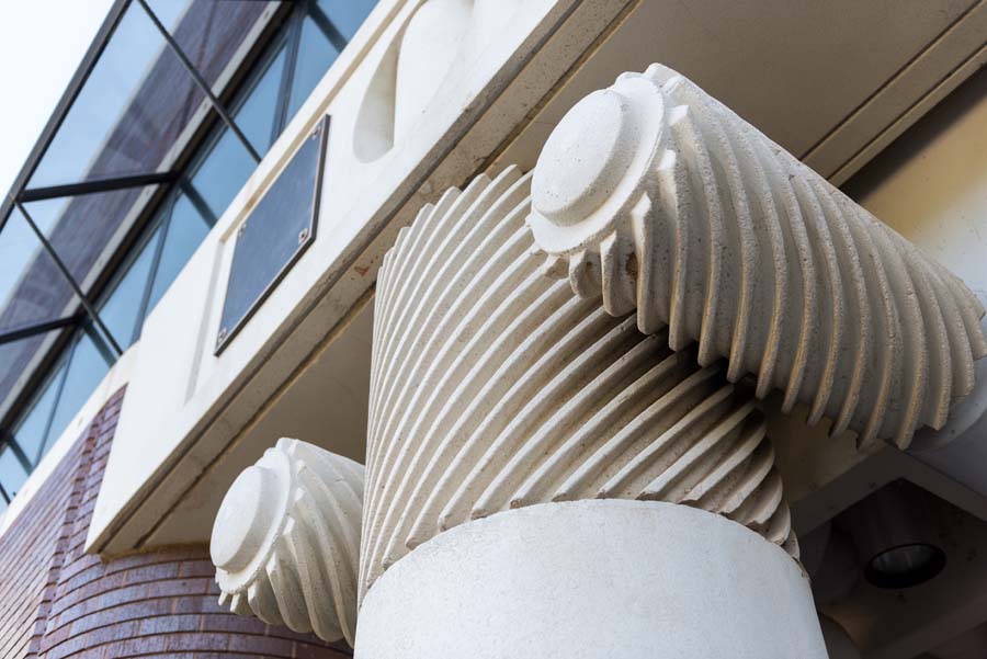 Ratchet gears recall classical Ionic volutes at the entrance to the Fuller E. Callaway Jr. Manufacturing Research Center on Ferst Drive.