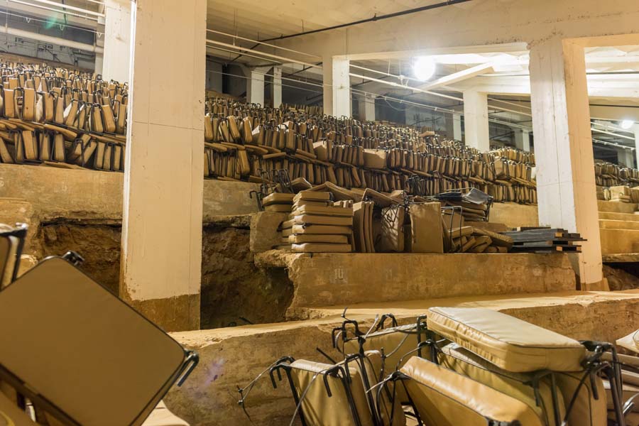 Today the space underneath the stands is used for storing game-day supplies, such as cushioned seatbacks.