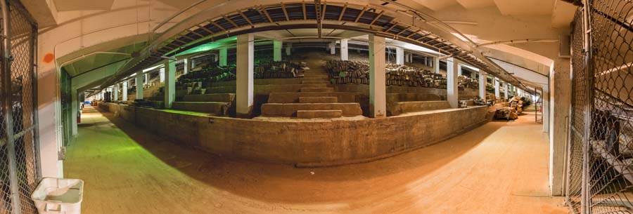 A panoramic photo shows the support beams and the relatively small size of the old stands compared to the new stands that were built on top.