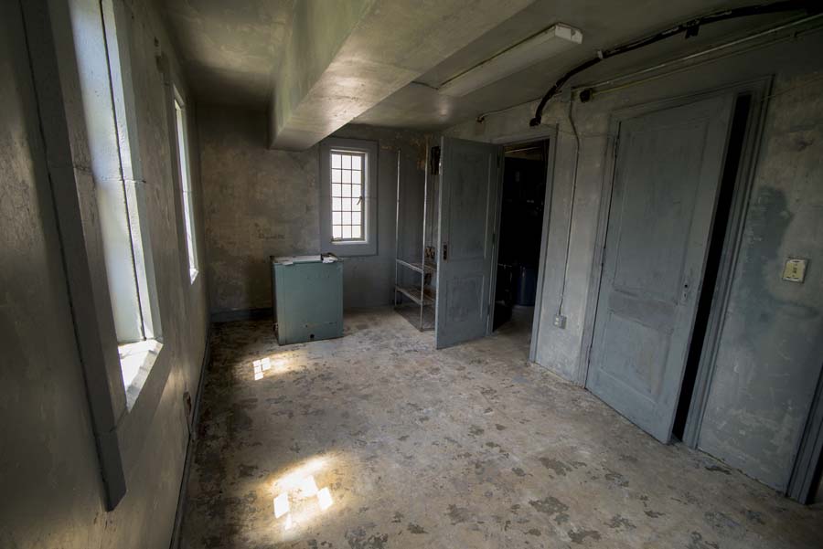 The apartment has stained glass windows on three sides, and a closet and bathroom along the other wall. Hidden Georgia Tech Daisy's Apartment