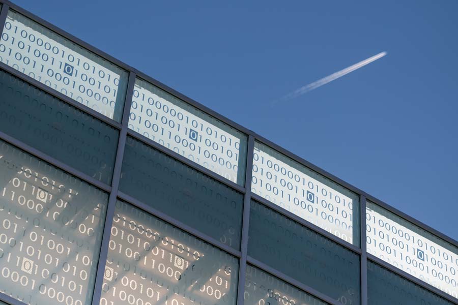 The binary code on the skywalk reflects a binary code theme throughout the Klaus Advanced Computing Building. It decodes to "KL AU S."