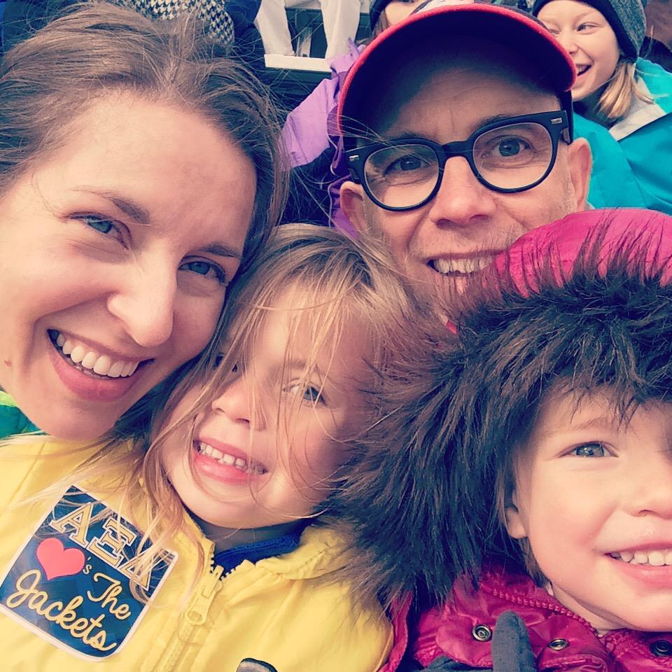 Amber Johnson and her husband, Steven (a 1996 chemical engineering graduate), and their two daughters at Georgia Tech’s 2014 Homecoming football game.