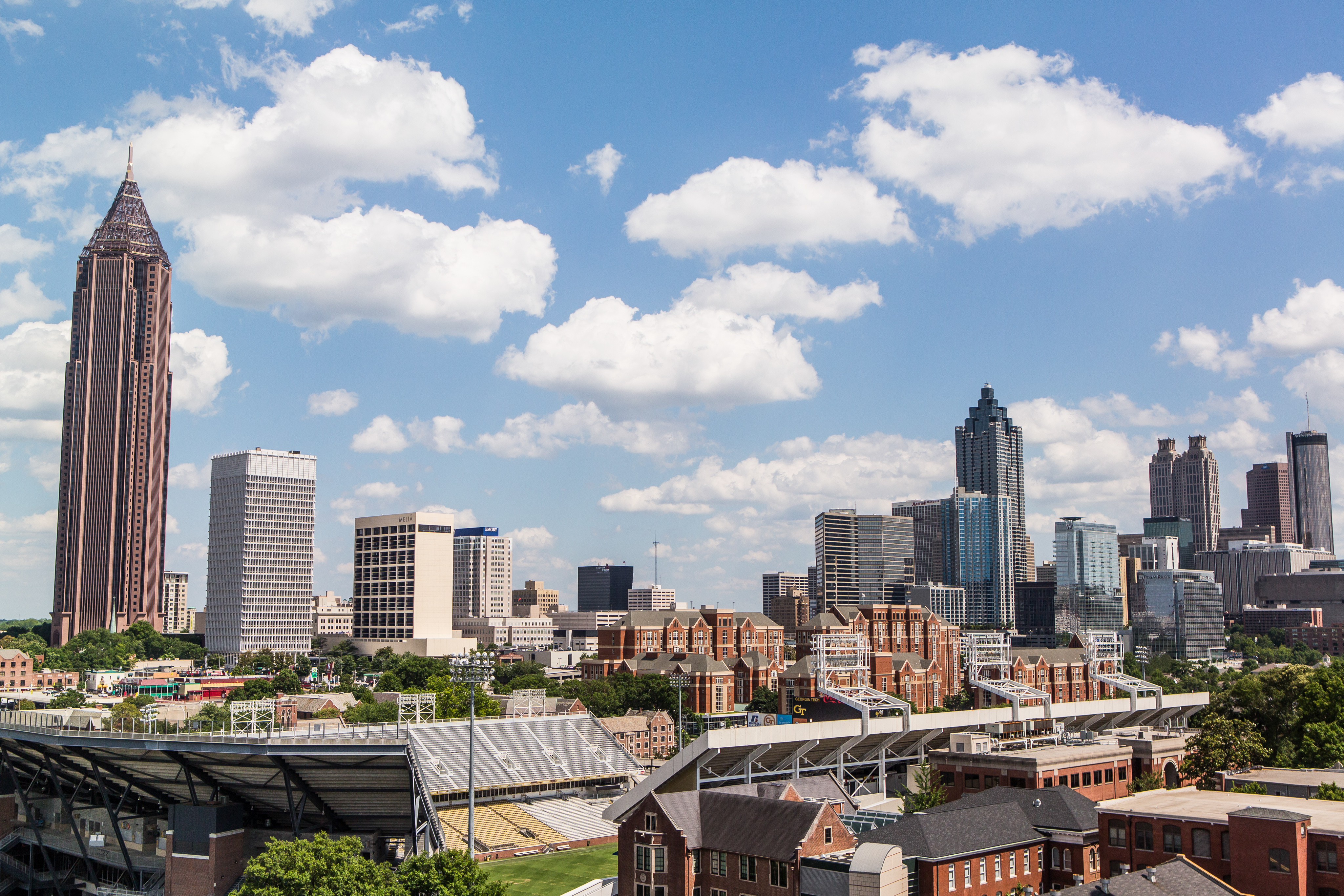 View of Georgia Tech against an Atlanta skyline (Photo Credit: Raftermen Photography)