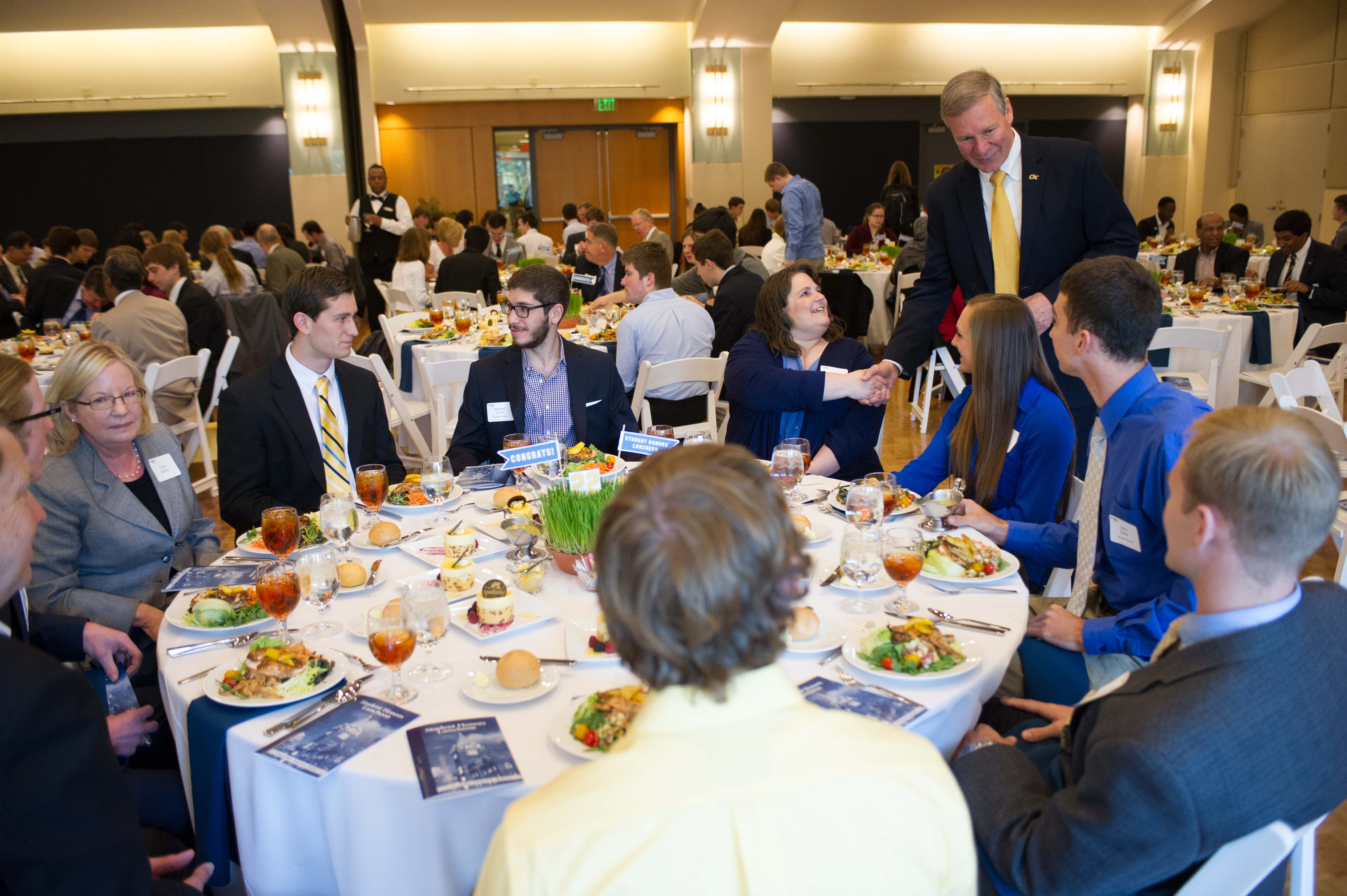 President G. P. "Bud" Peterson talks with students and parents at the 2014 Student Honors Luncheon. 