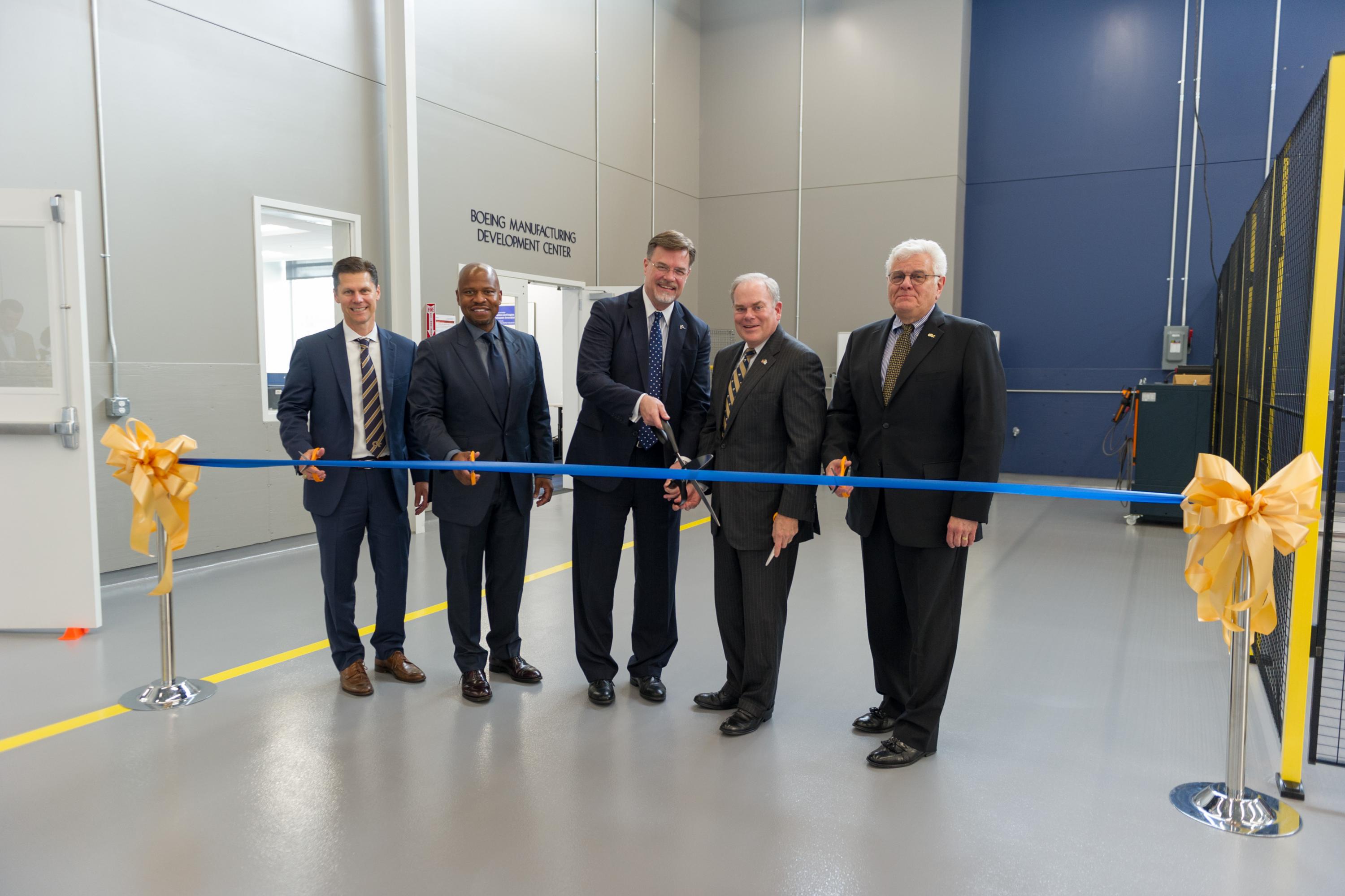 Boeing executives and Steve Cross, Georgia Tech executive vice president for Research, cut the ribbon to officially open the Boeing Manufacturing Development Center on campus.
Photo by Rob Felt. Boeing executives and Steve Cross, Georgia Tech executive vice president for Research, cut the ribbon to officially open the Boeing Manufacturing Development Center on campus.
Photo by Rob Felt.