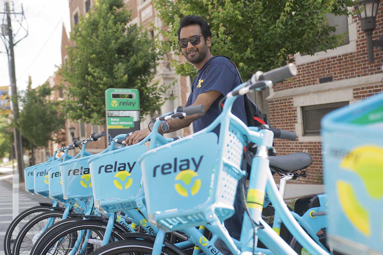 Anirudh Gattani, a civil engineering graduate student, approaches the Relay bike hub on Techwood Drive at North Avenue. 