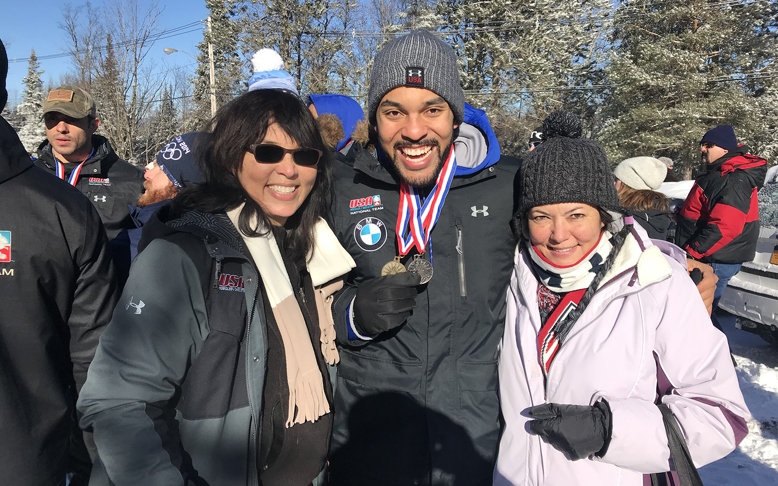 Sandra Kinney (left), her son Chris, and her sister at the North America’s Cup in Lake Placid, New York, on Jan. 14. The event was the final qualifier for the 2018 Winter Olympics. Chris earned a gold and silver medal and the event.