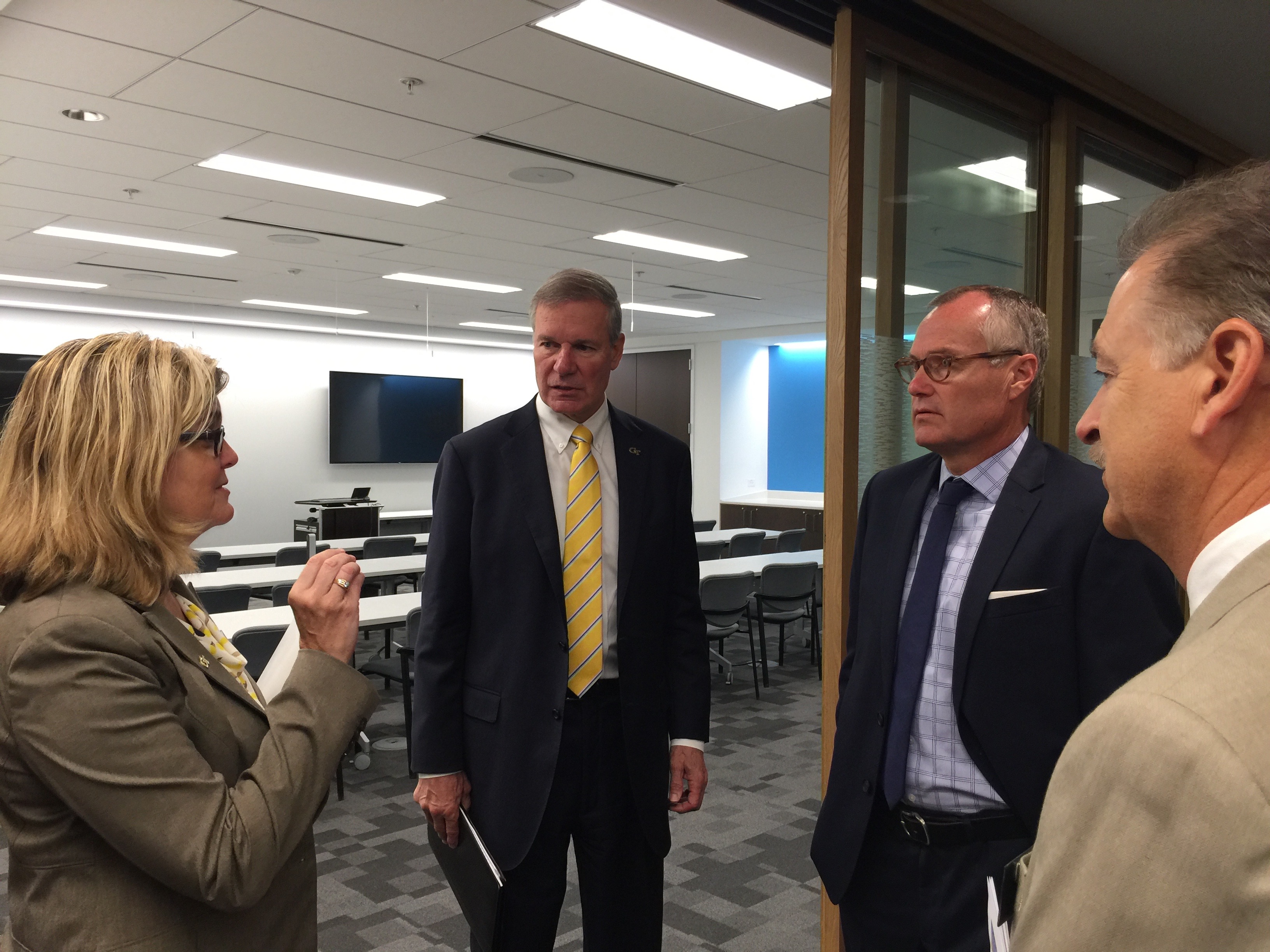 Jennifer Bonnett (left), general manager of Georgia Tech's Advanced Technology Development Center, explains how the incubator works with entrepreneurs across the state to Tech President G.P. "Bud" Peterson (center), Georgia Lt. Gov. Casey Cagle (right), and Chris Downing (near right), vice president of Tech's Enterprise Innovation Institute. Cagle visited the Tech campus Oct. 6 to learn more about the Institiute's innovation ecosystem. (Photo credit: Péralte C. Paul)