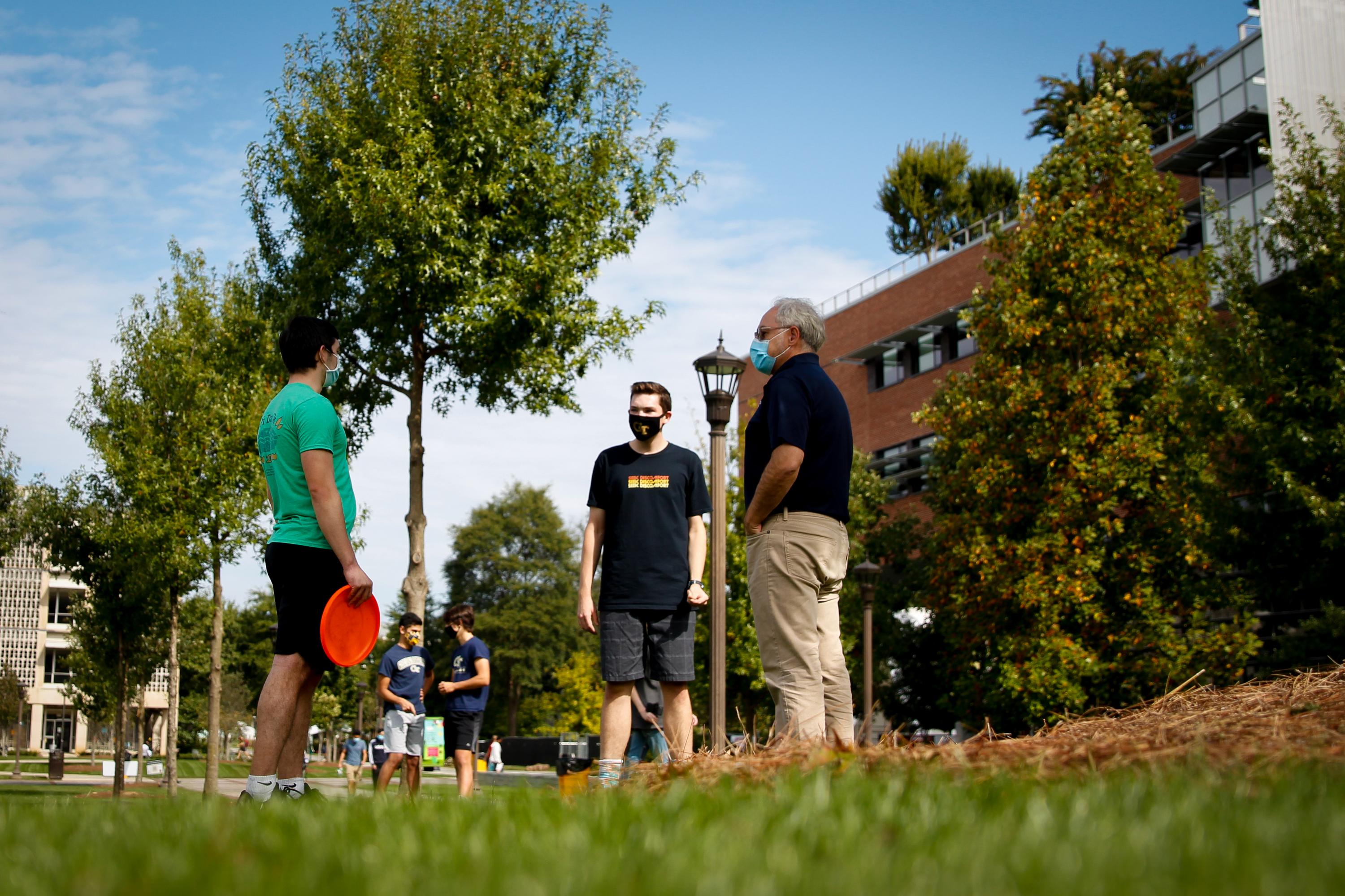 President Cabrera met Christopher Ozgo and Reed Blanchard on Tech Green to play frisbee and chat about the semester.