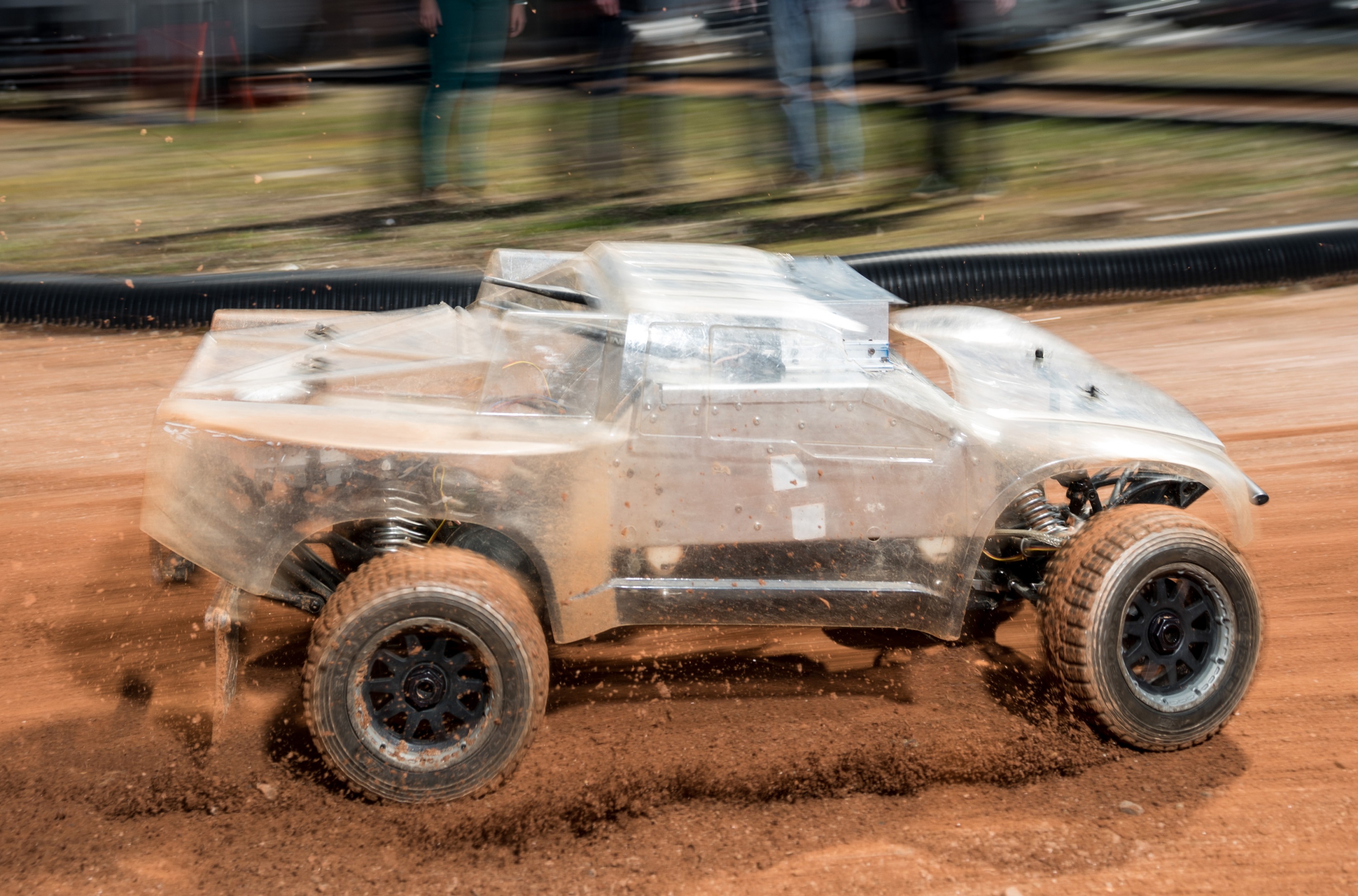 At the Georgia Tech Autonomous Racing Facility, researchers are studying a one-fifth-scale autonomous vehicle as it traverses a dirt track. The work will help the engineers understand how to help driverless vehicles face the risky and unusual road conditions of the real world. (Credit: Rob Felt, Georgia Tech)