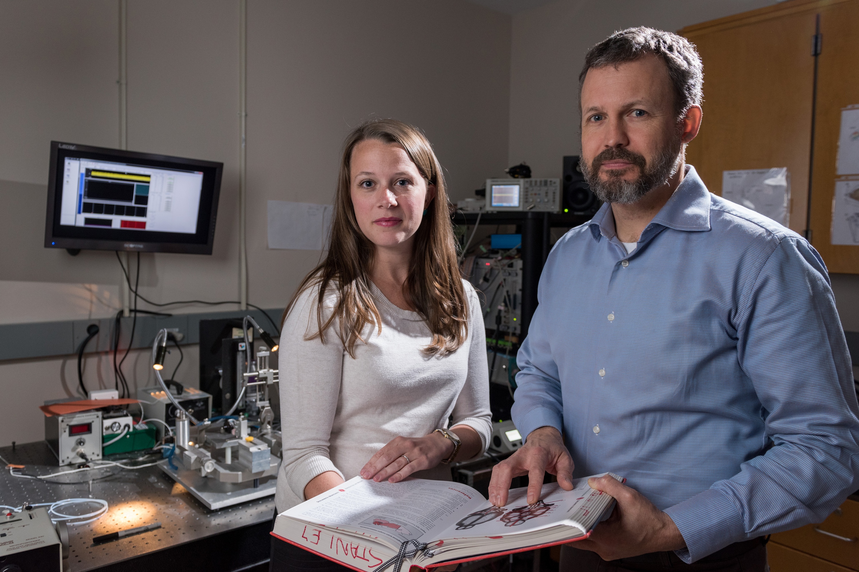 Using optogenetics and other technology, researchers have for the first time precisely manipulated bursting activity of cells in the thalamus, tying it to the sense of touch. Shown are Georgia Tech graduate student Clarissa Whitmire and Georgia Tech professor Garrett Stanley.(Credit: Rob Felt, Georgia Tech)