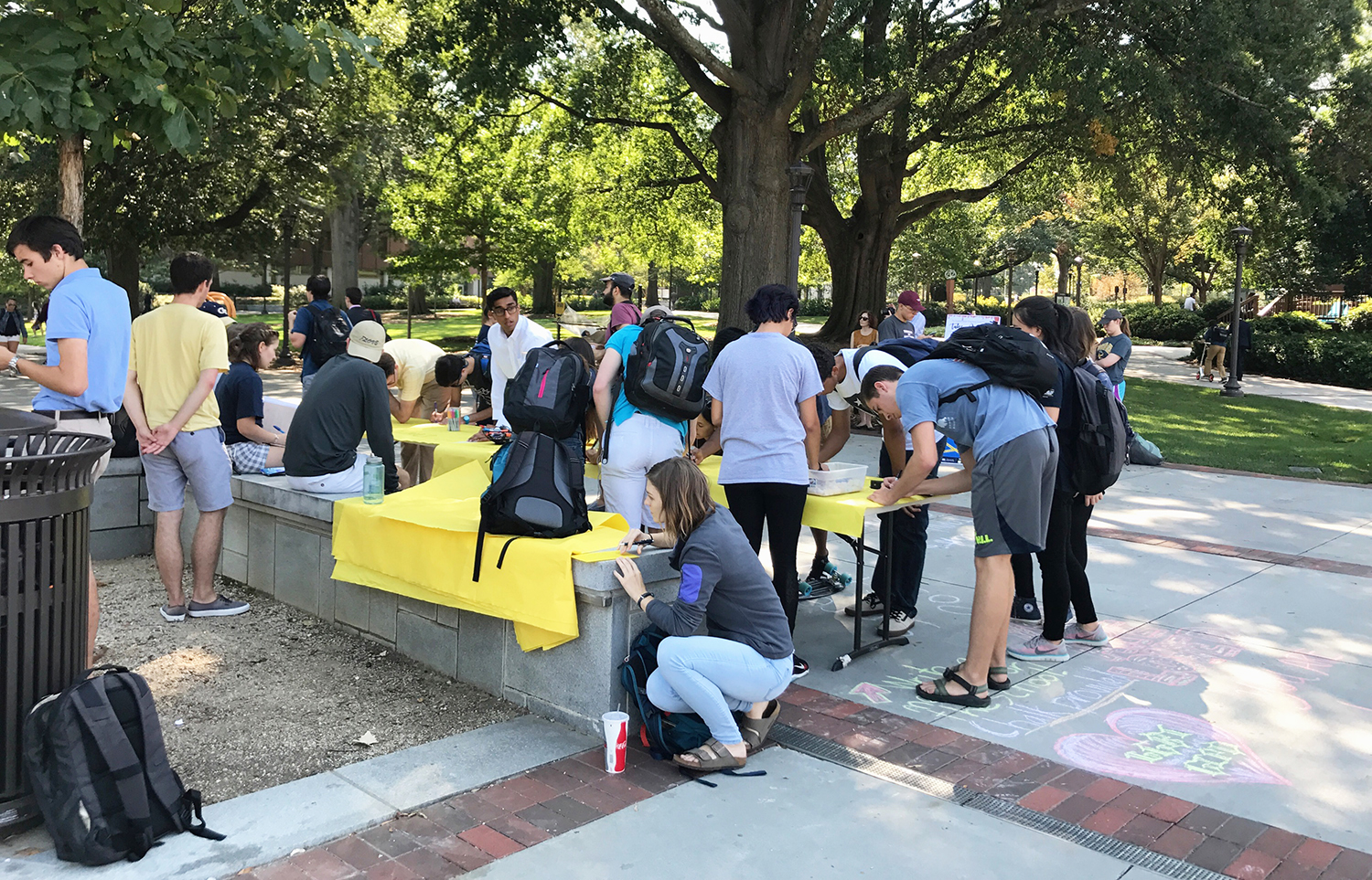 Students set up a space on Tech Walk to share notes of positivity