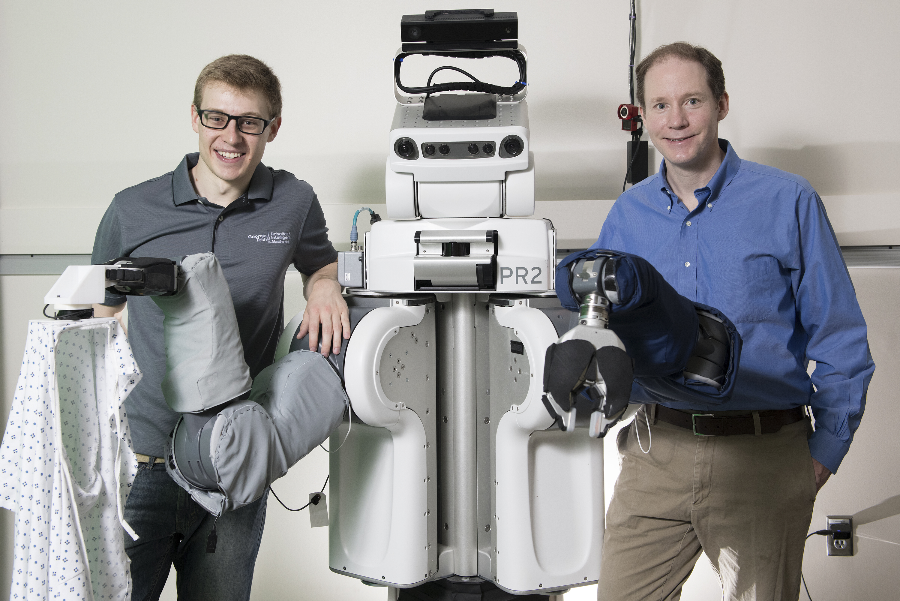 Left to right: Zackory Erickson, a PR2 robot, and Charlie Kemp Left to right: Zackory Erickson, a PR2 robot, and Charlie Kemp