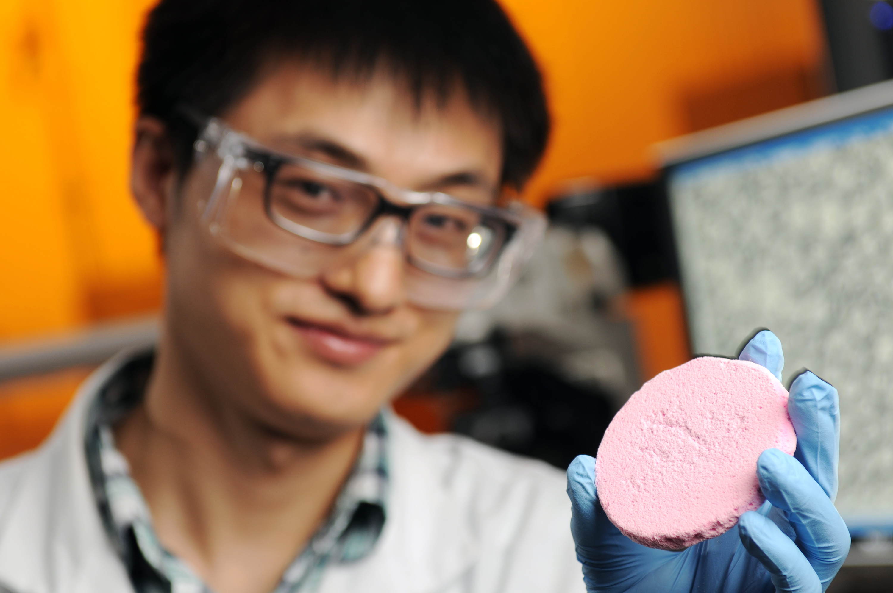 Yi Zhang, a graduate student co-advised by Prof. Sven Behrens and Prof. Carson Meredith in the School of Chemical &amp; Biomolecular Engineering at Georgia Tech, is shown holding a porous solid material prepared from a capillary foam. (Credit: Gary Meek)