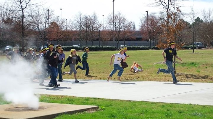 A group of zombies run through campus on the hunt for humans during Humans vs. Zombies. 