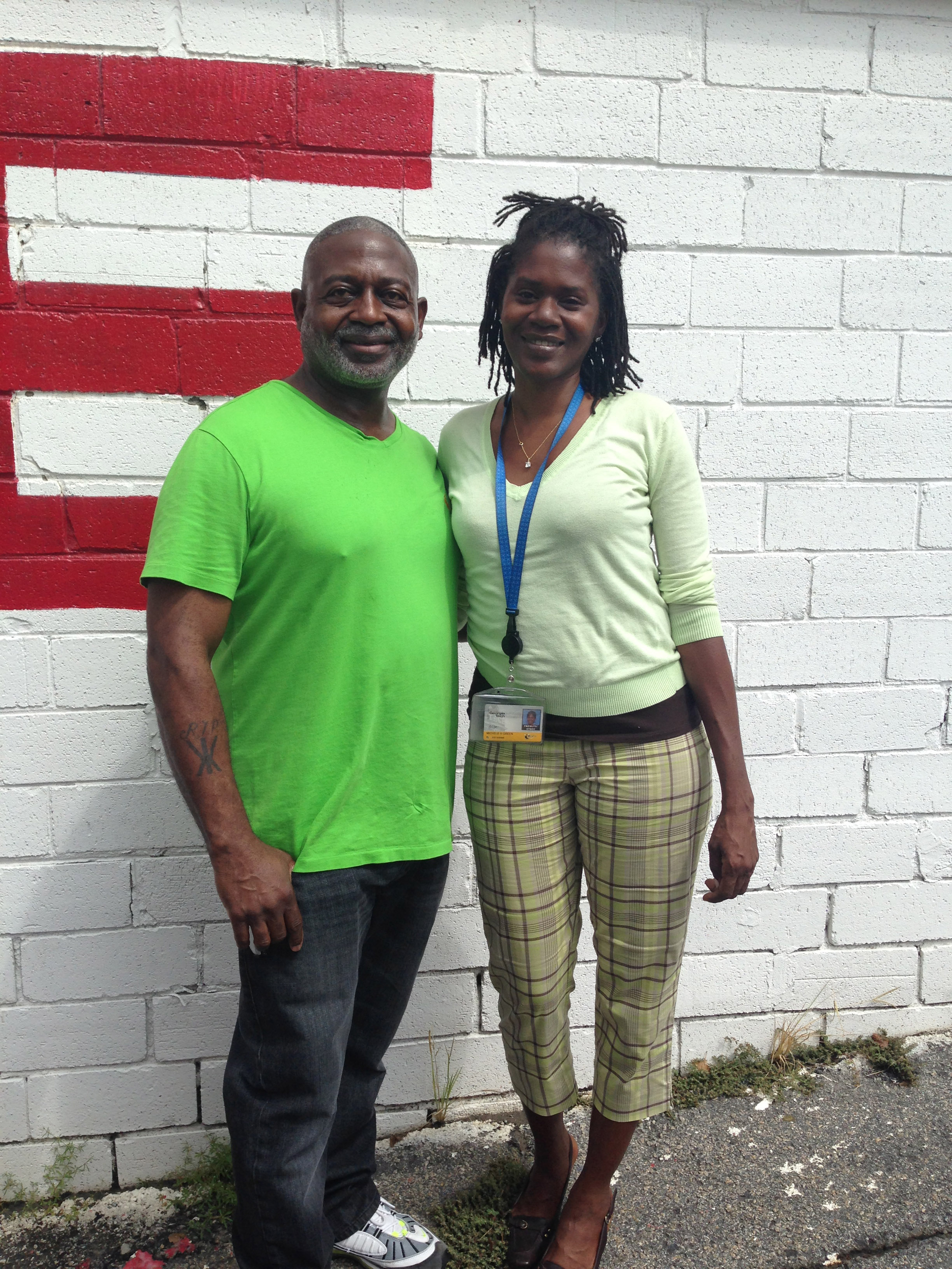 Michele Green, administrative professional for the Georgia Tech Research Corporation, found assistance through the Atlanta Step-Up Society when she was in need. She poses with Robert Barber, the Society’s founder, at the Step-Up thrift store on Monroe Drive in Midtown.