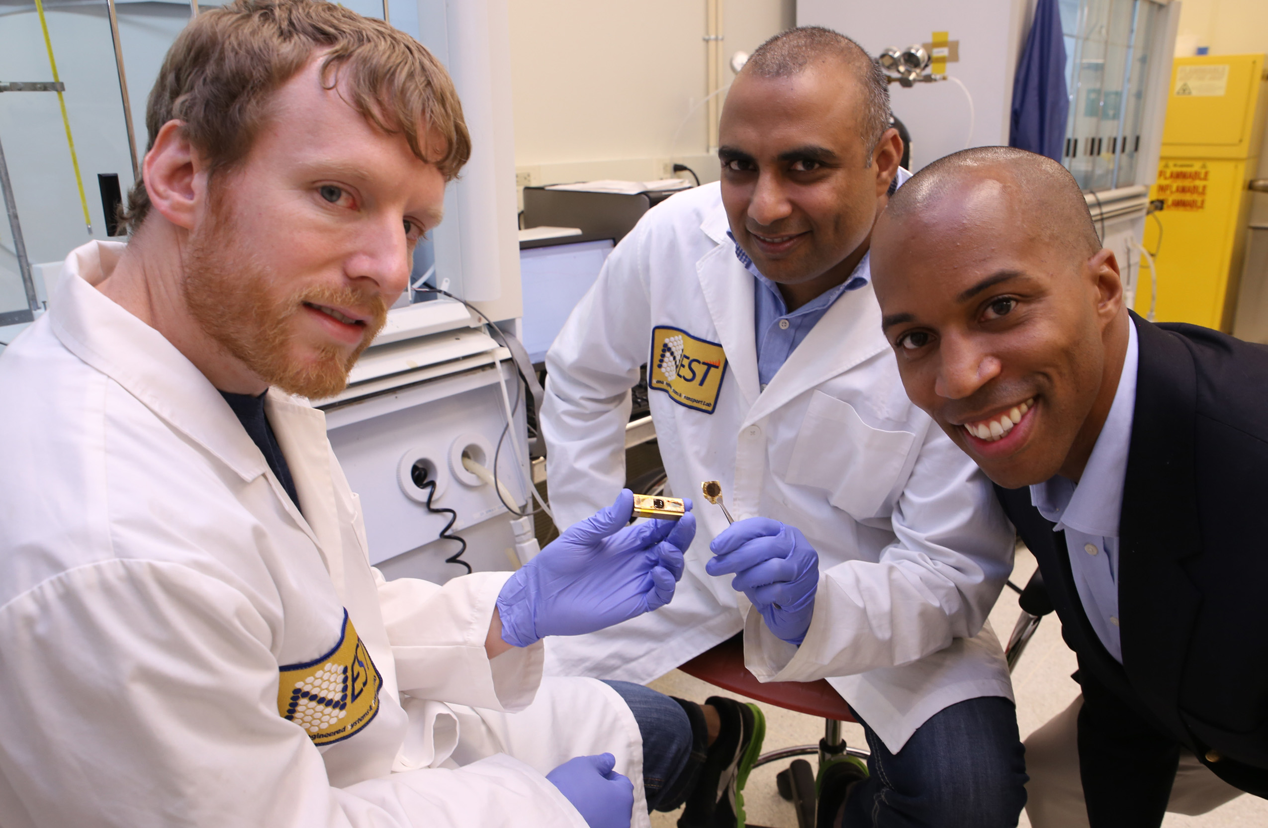 Georgia Tech researchers have developed a polymer material that can reliably conduct heat from electronic devices. Shown (l-r) are Thomas Bougher, a Ph.D. student in the George W. Woodruff School of Mechanical Engineering, Virendra Singh, a research scientist in the Woodruff School, and Baratunde Cola, an assistant professor. (Georgia Tech Photo: Candler Hobbs) Georgia Tech researchers have developed a polymer material that can reliably conduct heat from electronic devices. Shown (l-r) are Thomas Bougher, a Ph.D. student in the George W. Woodruff School of Mechanical Engineering, Virendra Singh, a research scientist in the Woodruff School, and Baratunde Cola, an assistant professor. (Georgia Tech Photo: Candler Hobbs)