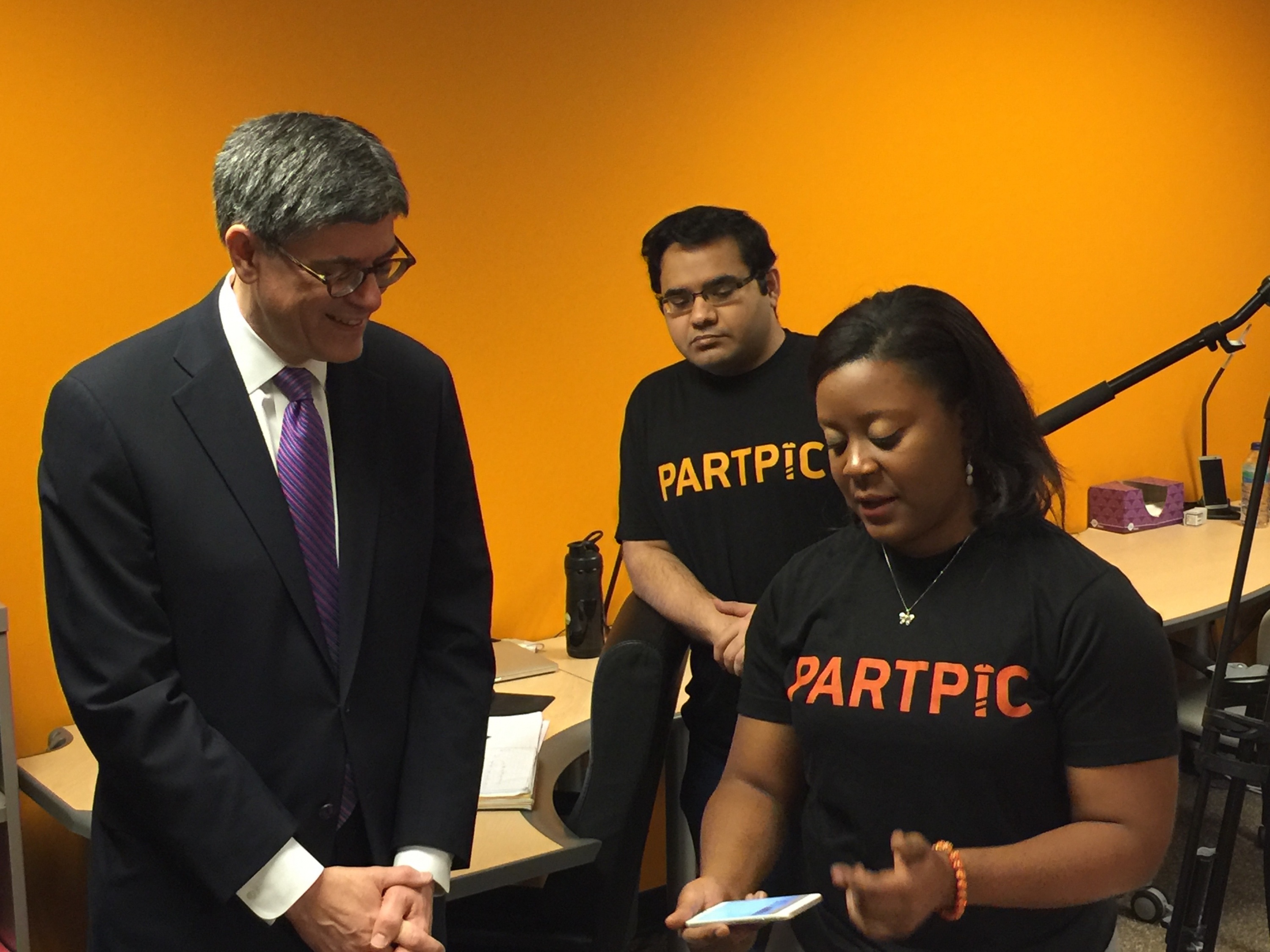 U.S. Treasury Secretary Jack Lew, left, listens to Nashlie H. Sephus, Ph.D. ECE 2014, as she explains visual recognition technology. Sephus is chief technology officer of Partpic, a startup technology company incubating at Georgia Tech's Advanced Technology Development Center (ATDC). Lew came to ATDC to meet with entrepreneurs and discuss the national economy, as well as hear the challenges they face in accessing capital and solutions they had.