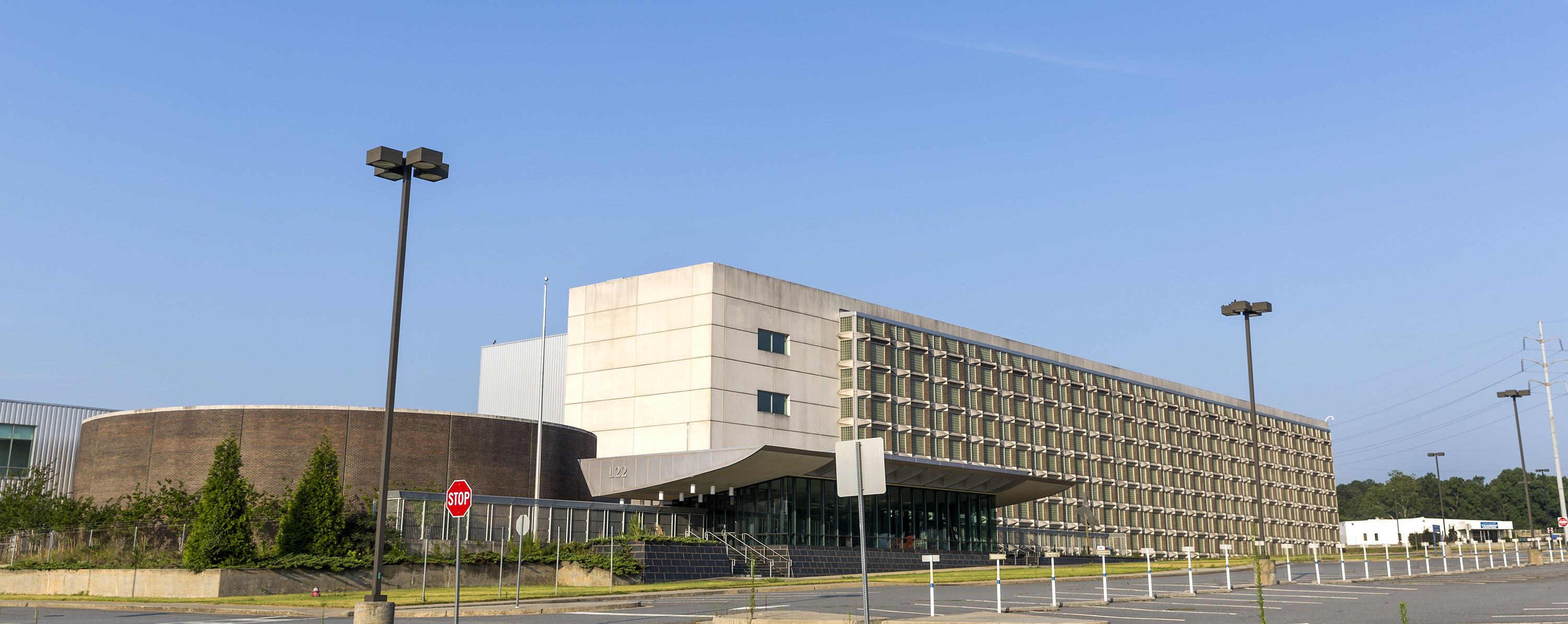 Two of the buildings included in the sale from Lockheed Martin to Georgia Tech are L-22, center, and L-59, small white building to the right. L-22 served as the main program, administrative and engineering building for the F-22 Raptor stealth fighter program from the mid-1990s until 2013 when the last of the F-22 employees left Marietta. L-59 was a training center.