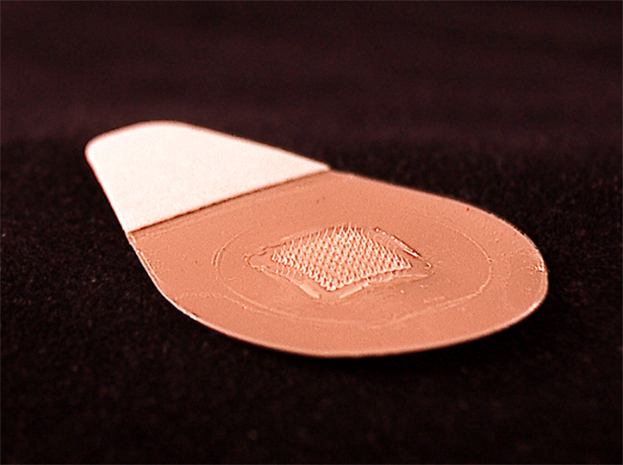 This close-up image shows the microneedle vaccine patch, which contains tiny needles that dissolve into the skin, carrying vaccine. A majority of study participants said they would prefer to receive the influenza vaccine using patches rather than traditional hypodermic needles. This close-up image shows the microneedle vaccine patch, which contains tiny needles that dissolve into the skin, carrying vaccine. A majority of study participants said they would prefer to receive the influenza vaccine using patches rather than traditional hypodermic needles.