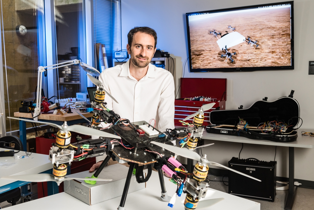 Jonathan Rogers with an autonomous flying quadcopter that could, in the future, lift a soldier.