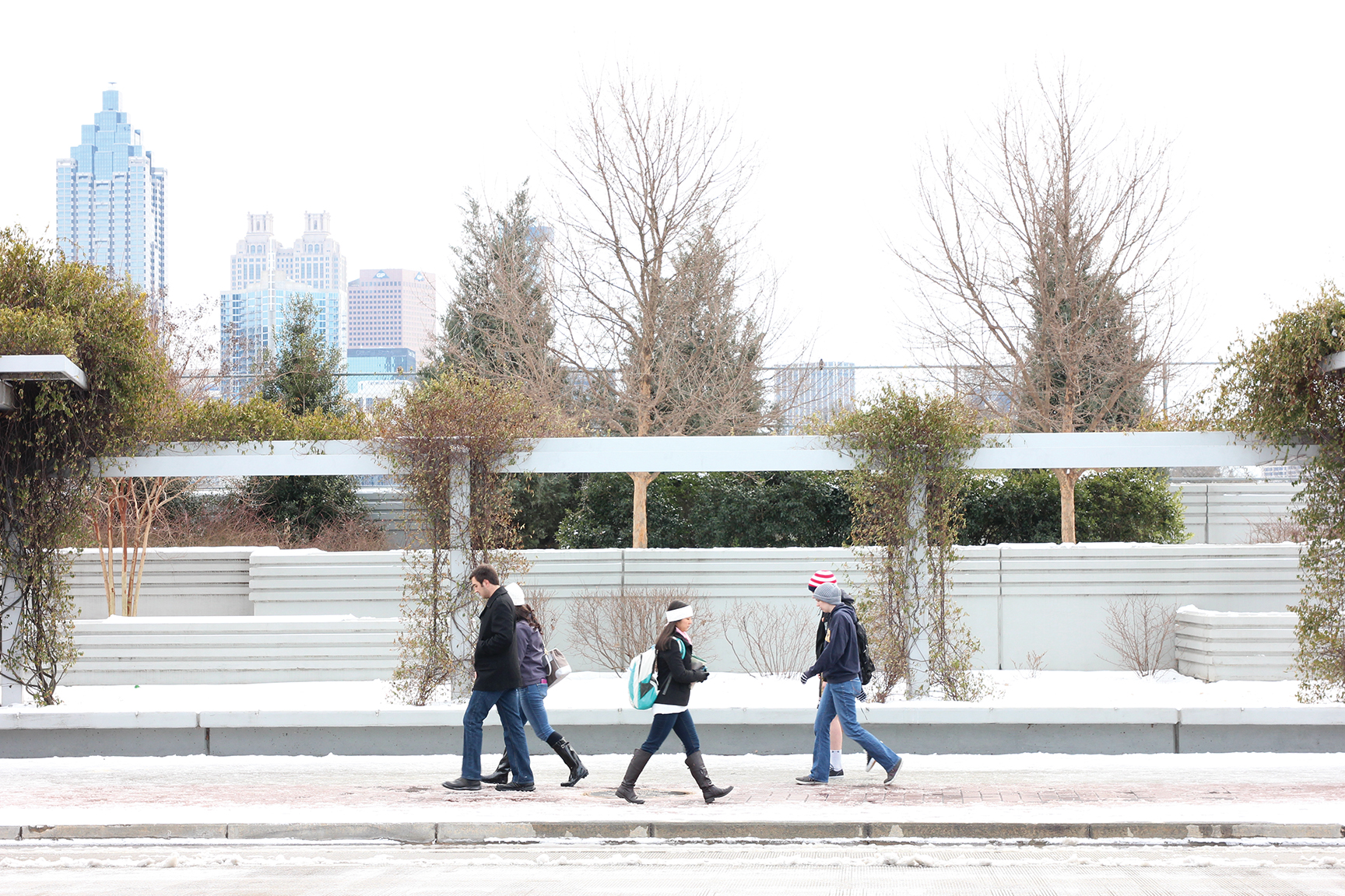 Students walk on the Fifth Street bridge during the January 2014 snow storm. Photo courtesy of GVU Center