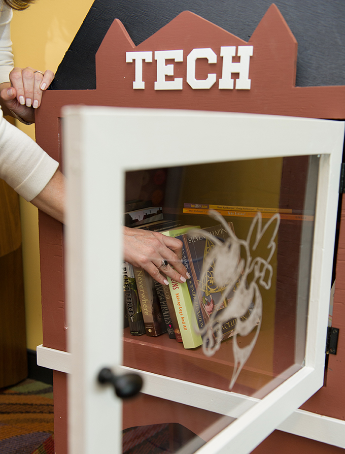 A group of students participating in a ThinkBig Living Learning Community built a Little Free Library for the Communication Center, located in Suite 447 of Clough Commons. 