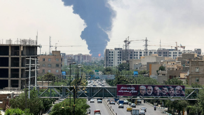 Heavy smoke and fire rise from an oil refinery in southern Tehran
