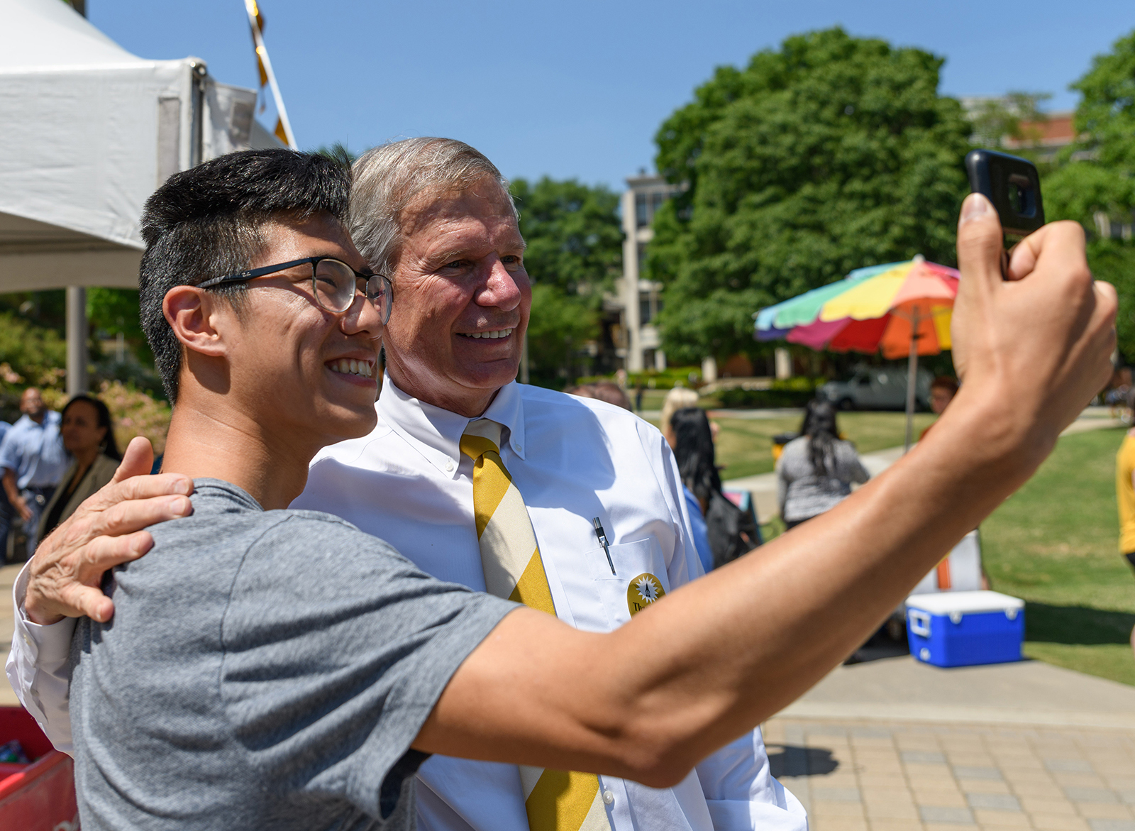peterson takes a selfie with a student