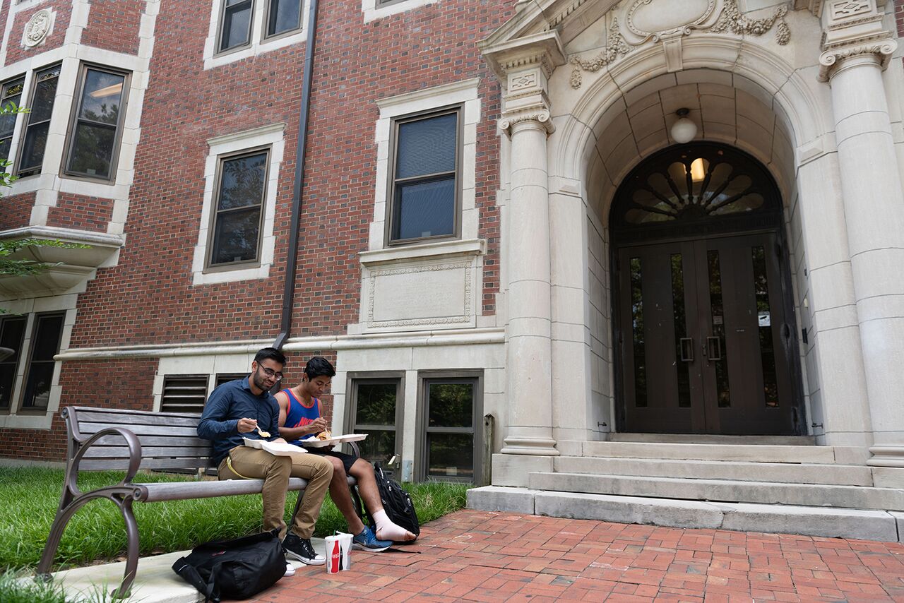 Students having lunch in front of DM Smith Building