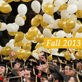 White and gold balloons dropping on Fall 2013 Georgia Tech graduatees at the Commencement ceremony.