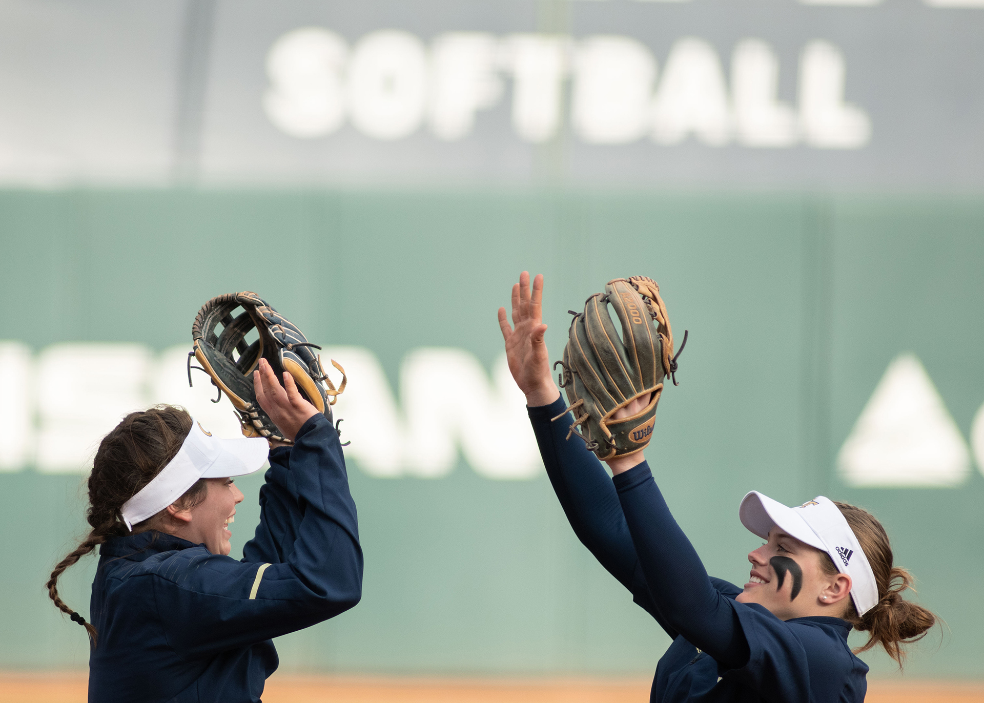 softball players high five