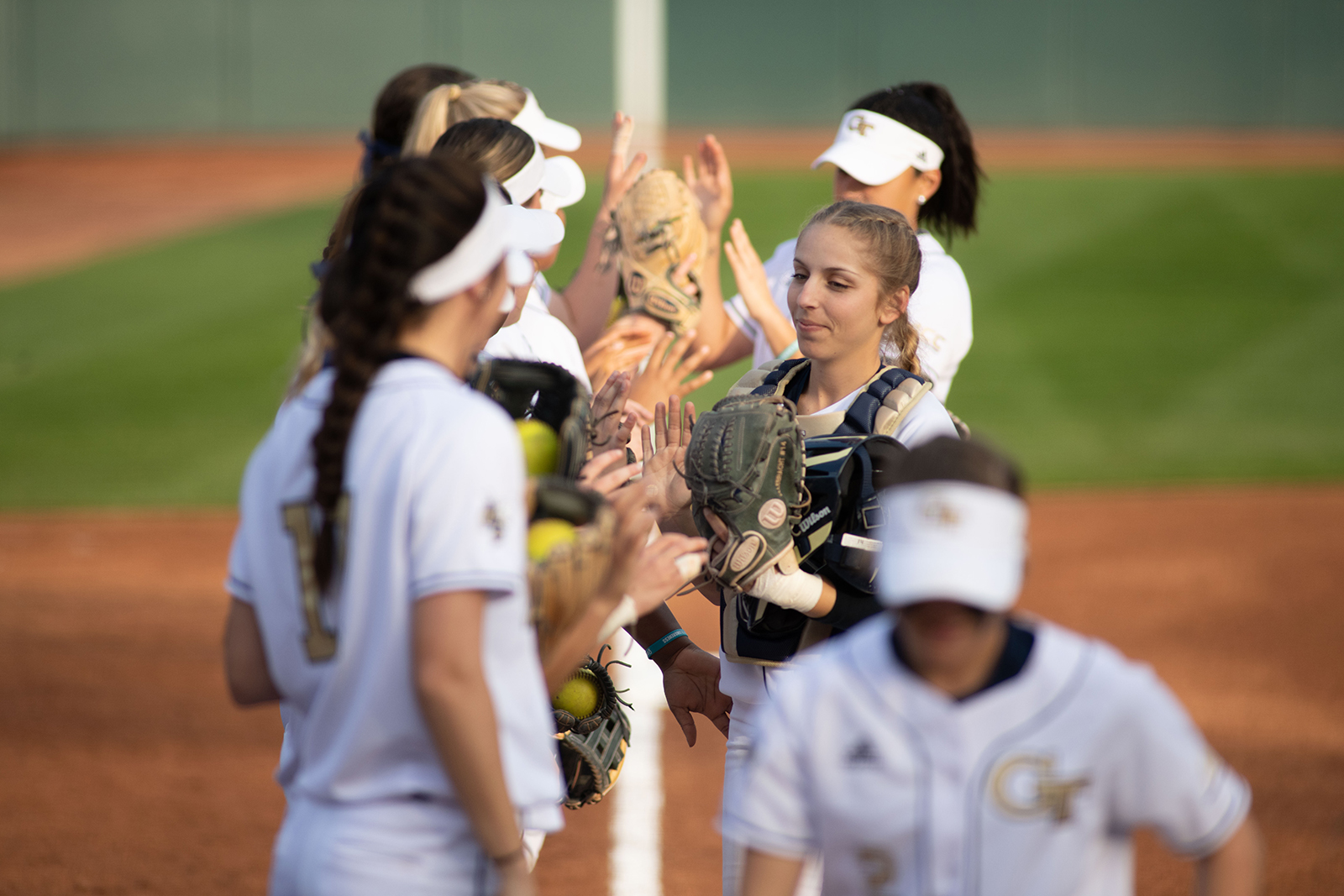 softball team gives high fives