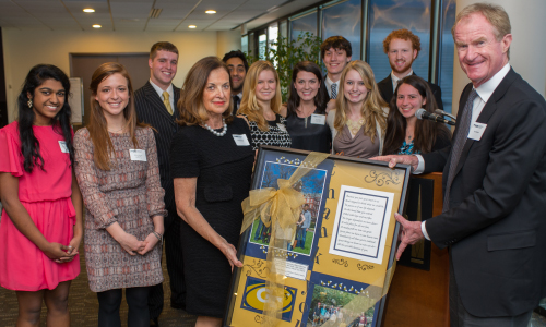 E. Roe & Penny Stamp with students