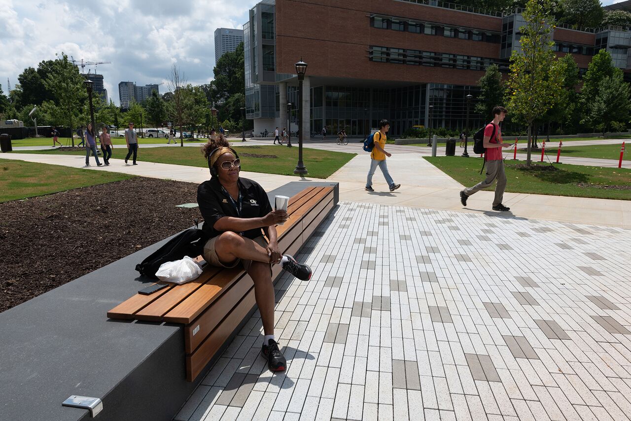 Lolita Ringfield,building inspector with Facilities, takes a lunch break at Texas Instruments Plaza outside the Van Leer Building. 