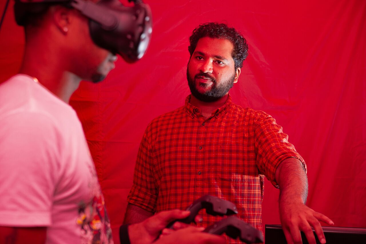 Ph.D. student Mikhail Jacob observes participant in the Props game.